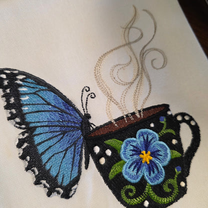 Towel ~ Morpho Butterfly On Edge of Cup Tea Towel with Embroidered Detail