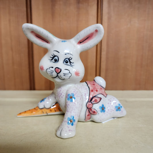 Bunny laying down with carrot