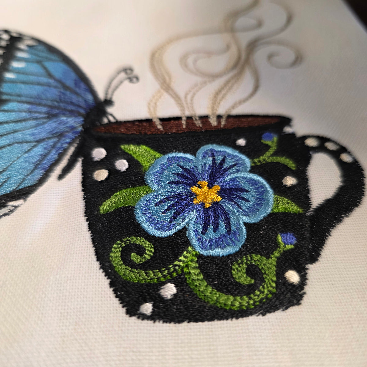 Towel ~ Morpho Butterfly On Edge of Cup Tea Towel with Embroidered Detail